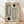 May include: Framed geometric poster with cream background featuring black line art of curved rectangular shapes and two dark green circles, displayed on light wood floor against white wall with natural lighting and shadows