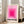 May include: Framed art print with concentric pink and magenta squares creating gradient effect from deep pink center to pale pink edges on cream background. Black text reads "BAUHAUS-AUSSTELLUNG WEIMAR JULI - SEPT 1923" below geometric design. Print in light wood frame leans against white wall next to beige upholstered sofa in bright, minimalist living room with large windows and natural light.