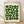 May include: Framed poster with cream background featuring green geometric circles and semicircles arranged in a grid pattern, displayed against white wall on wooden floor with natural lighting creating soft shadows. Light wood frame surrounds the minimalist Bauhaus-style design with black text at top and bottom.