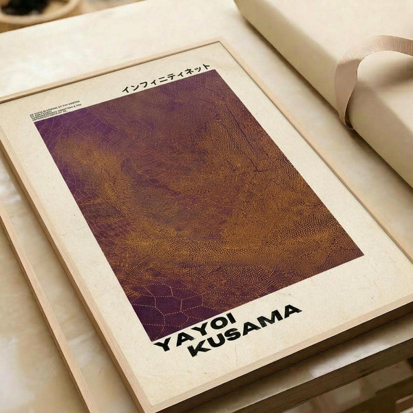 May include: Abstract art print with textured purple and orange gradient background featuring dotted pattern, displayed in cream-colored frame on wooden surface alongside rolled paper tubes. The artwork shows organic flowing lines with stippled texture transitioning from deep purple at top to warm amber tones below.