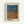 May include: Framed art print hanging on white wall showing abstract dotted pattern in blue and orange tones. Japanese text appears at top, artist name at bottom. Natural wood frame with white matting. Artwork features flowing, wave-like forms created with small dots transitioning from deep blue at top to warm orange below.