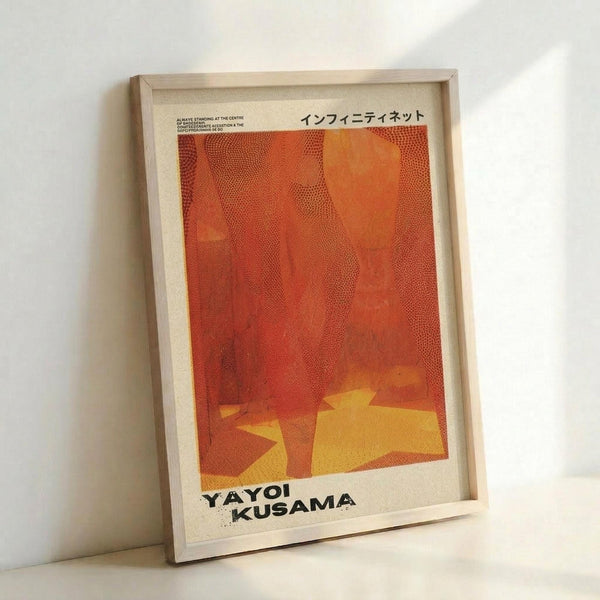 May include: Framed art print with orange and red abstract design featuring flowing dotted patterns and yellow geometric shapes at bottom, displayed in light wood frame against white wall. The poster shows textural halftone effects creating wave-like forms across the composition, with Japanese text at top and "YAYOI KUSAMA" text at bottom in bold black letters.