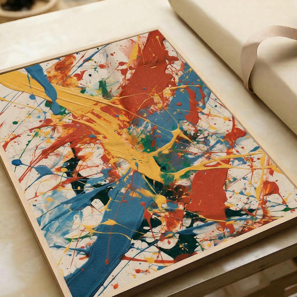 May include: Abstract expressionist artwork displayed in white paper roll backdrop. Vibrant paint splatters and gestural brushstrokes in bold red, blue, yellow, and green create dynamic composition on white background. Energetic drips and color mixing throughout square format print, showing characteristic action painting technique with layered paint application.