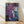May include: Framed abstract art print leaning against white wall on light wood floor. Artwork features fluid paint splatters and marbled textures in deep purples, blues, and teals with golden cream accents and delicate white linear details throughout. Natural wood frame surrounds the vertical rectangular print. Soft natural lighting creates gentle shadows on the wall.