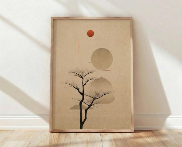 May include: Framed minimalist artwork featuring a bare black tree silhouette against a beige textured background with geometric shapes - a small red-orange circle at top, large tan circle in middle, and flowing abstract forms behind the tree. Natural wood frame sits on light wooden floor against white wall with soft window shadow patterns.