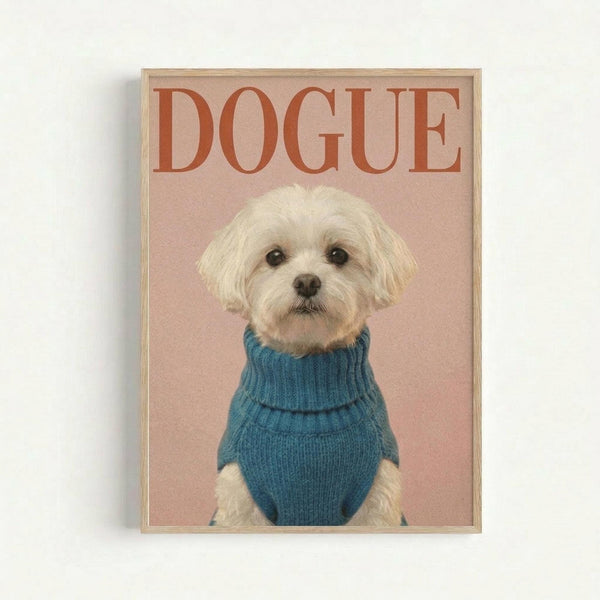 A small white fluffy dog wearing a blue turtleneck sweater sits against a soft pink background in this framed poster print. The image mimics a fashion magazine cover with "DOGUE" written in large red letters at the top. The dog appears to be a Maltese with cream-colored fur and dark eyes, photographed in portrait style. The artwork is displayed in a thin wooden frame against a white wall.