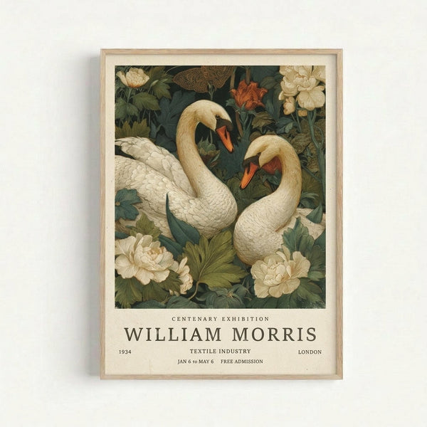 May include: Framed poster print displayed on white wall featuring two white swans with orange beaks surrounded by cream peonies and green foliage in William Morris decorative style. Light wood frame with cream matting. Exhibition poster text reads "Centenary Exhibition William Morris 1934 Textile Industry London Jan 6 to May 6 Free Admission" in serif typography below botanical swan illustration.