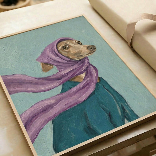 May include: Whimsical painted portrait of a tan Italian Greyhound wearing a flowing purple headscarf and teal coat against a soft mint green background. The artwork is displayed in a light wood frame on white wrapping paper with cream ribbon nearby. The painting has visible brushstrokes and captures the dog's gentle expression and elegant pose in an folk art style.