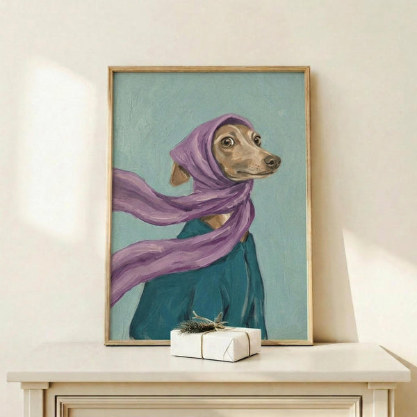 May include: Framed painting of an Italian Greyhound wearing a flowing purple headscarf and teal coat against a soft mint green background, displayed on a light wood shelf next to a small wrapped gift with twine. The artwork has visible brushstroke texture and is housed in a thin natural wood frame.