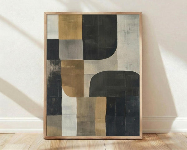 May include: Abstract geometric artwork in light wood frame leaning against white wall on hardwood floor. Composition features overlapping rectangular and curved shapes in muted palette of charcoal black, warm ochre yellow, sage green, cream and gray. Textured brushstroke effects and translucent layering create depth. Soft natural lighting casts gentle shadows on minimal interior setting.