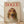 May include: Framed poster print featuring a collie dog wearing pink round sunglasses and a pink headscarf with "DOGUE" text in red letters above, displayed on light wooden floor against white wall with natural lighting shadows