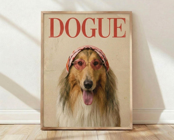 May include: Framed poster print featuring a collie dog wearing pink round sunglasses and a pink headscarf with "DOGUE" text in red letters above, displayed on light wooden floor against white wall with natural lighting shadows