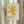 May include: Framed art print with yellow geometric star shape on cream textured background, displayed on wall next to dried pampas grass stems in neutral bohemian interior setting with natural lighting and beige curtains