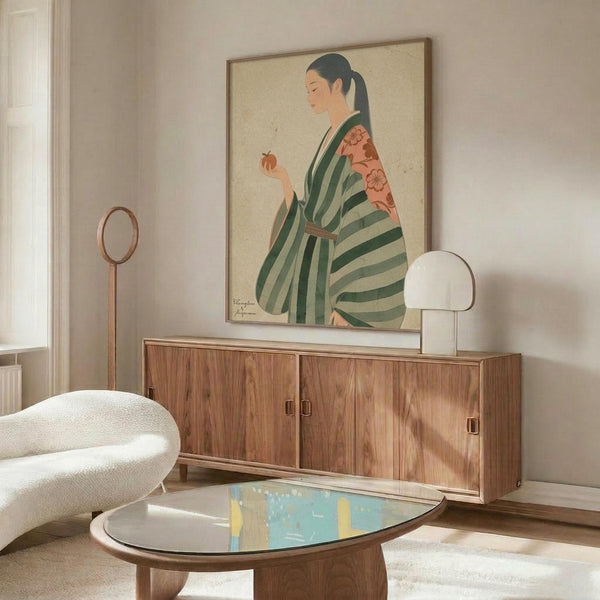 May include: Japanese woman artwork in wooden frame above mid-century walnut credenza. Woman wears green striped kimono with coral floral sleeves, holding persimmon fruit. Cream textured background. Modern living room setting with white curved chair, glass coffee table, floor lamp. Soft natural lighting creates warm shadows on furniture.