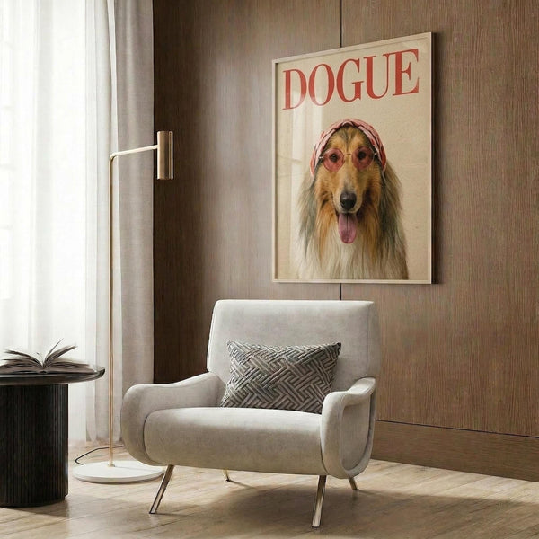 May include: Framed poster featuring a collie dog wearing pink sunglasses and headscarf styled as fashion magazine cover with "DOGUE" text in red letters, displayed on wood-paneled wall above cream upholstered chair with geometric throw pillow, brass floor lamp and side table with open book nearby