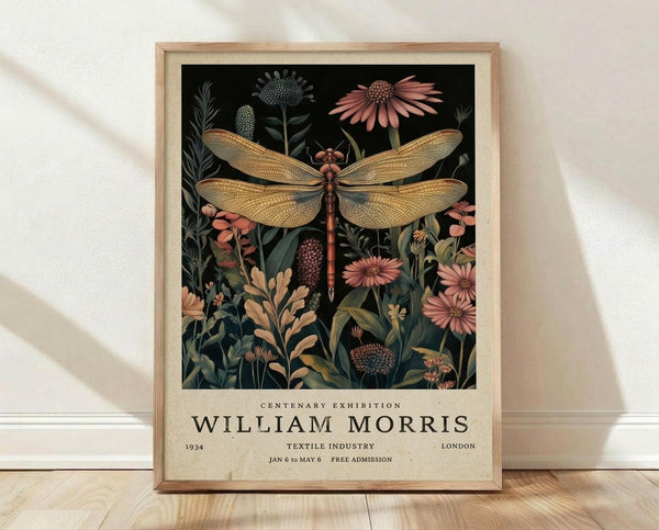 May include: Framed vintage-style botanical poster featuring a detailed golden dragonfly with intricate wing patterns surrounded by wildflowers including pink coneflowers and various stems on black background. Light wood frame with cream matting, leaning against white wall on light wooden floor with natural window shadows.
