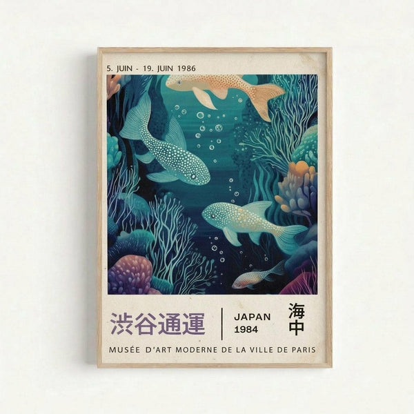 Framed vintage-style exhibition poster featuring an underwater scene with colorful fish swimming among coral and seaweed in deep blue-green tones. The artwork shows dotted fish in teal and orange hues with flowing aquatic plants and coral formations. Text at top reads "5. JUIN - 19. JUIN 1986" and bottom includes Japanese characters, "JAPAN 1984" and "MUSÉE D'ART MODERNE DE LA VILLE DE PARIS". Light wood frame mounted on white wall.