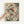 May include: Hand holding a framed vintage-style illustration featuring two detailed fish with pink-red fins swimming among green aquatic plants and bubbles. The artwork has a cream background with botanical elements and is displayed in a light wood frame against a white wall.