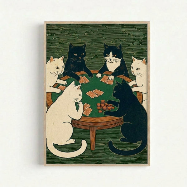Framed woodblock-style print showing six cats gathered around a green circular card table playing poker. Three white cats and three black cats (including one black and white tuxedo cat) sit on wooden chairs holding playing cards in their paws. Red poker chips are stacked on the felt table surface. The artwork features bold linework and muted colors against a green textured background, displayed in a light wood frame on a white wall.