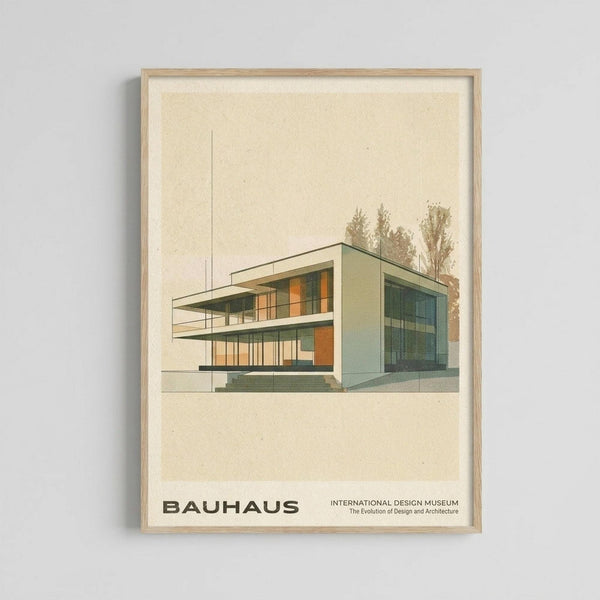 May include: Framed architectural poster showing modernist building illustration in muted green, orange, and cream colors against beige background. Features clean geometric lines, large windows, and flat roof with trees in background. Bauhaus text at bottom. Light wood frame mounted on white wall.
