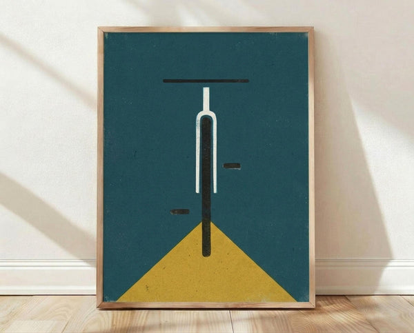 May include: Framed minimalist geometric poster print featuring abstract bicycle front view with white and black vertical lines on teal background, yellow triangular base element, displayed in light wood frame against white textured wall on wooden floor
