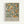 Vintage botanical poster featuring orange citrus fruits and green foliage in William Morris's decorative style, with exhibition text at bottom reading "Centenary Exhibition William Morris 1934 Textile Industry London Jan 6 to May 6 Free Admission" on cream background in light wood frame against white wall