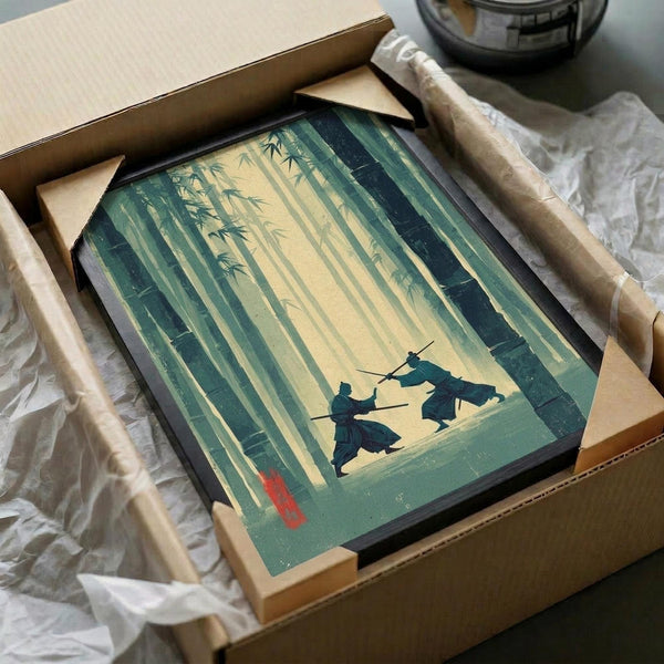 May include: Framed artwork in shipping box with protective packaging showing two silhouetted samurai warriors dueling with swords in a misty bamboo forest. The print features muted green and yellow tones with tall bamboo stalks creating vertical lines throughout the composition. Red artist seal visible in lower left corner. Black frame surrounded by cardboard corners and white tissue paper wrapping.