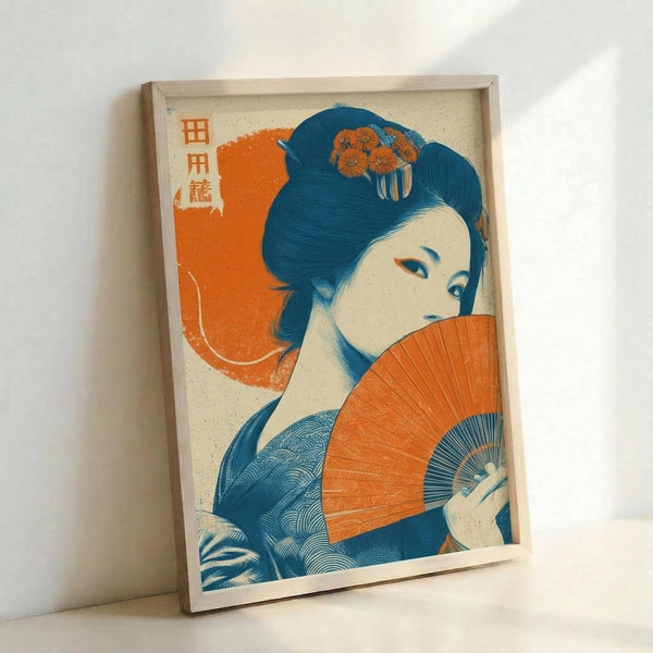 May include: Framed vintage-style Japanese woodblock print featuring a geisha with elaborate blue hair adorned with orange chrysanthemums, holding a vibrant orange folding fan. The artwork displays traditional ukiyo-e aesthetic with bold orange and blue color palette against cream background. Print is displayed in light wooden frame leaning against white wall corner, showing textured paper surface and dimensional framing.