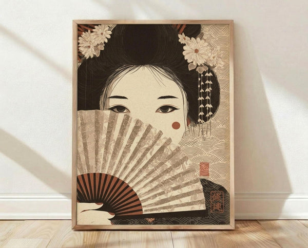 May include: Framed vintage-style Japanese art print featuring a geisha with elaborate black hair adorned with white flowers, holding a decorative fan that partially covers her face, set against a beige background with wave patterns. The artwork uses muted earth tones and is displayed in a light wood frame on wooden flooring against a white wall with natural lighting.