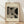 May include: Framed Bauhaus-style poster with geometric black and white design featuring curved and linear elements, displayed on light wooden floor against white wall with natural window lighting creating soft shadows