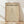 May include: Framed Bauhaus poster print with beige aged paper background featuring black geometric cone design and "LESS IS MORE" text, displayed in thin wood frame leaning against white textured wall on light wooden floor with natural window lighting creating soft shadows
