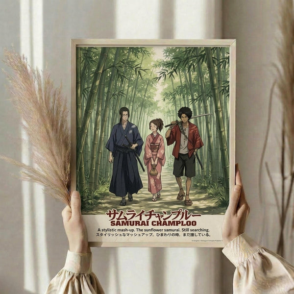 May include: Person holding framed poster print featuring three anime characters walking through bamboo forest path. Left figure wears dark blue traditional robes, center character in pink kimono, right figure in red jacket with sword. Lush green bamboo creates tunnel effect with dappled sunlight. Japanese text at bottom with English subtitle. Light wood frame, dried pampas grass visible, soft natural lighting through window curtains.