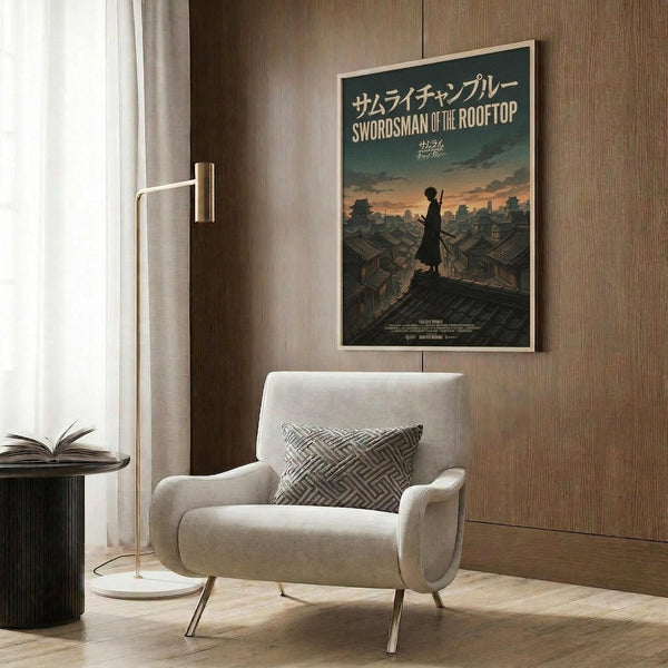 May include: Framed anime poster featuring silhouetted swordsman figure standing on traditional Japanese rooftops against sunset sky, displayed on wood-paneled wall above cream upholstered armchair with geometric patterned pillow, modern floor lamp and side table with open book nearby, warm neutral interior lighting