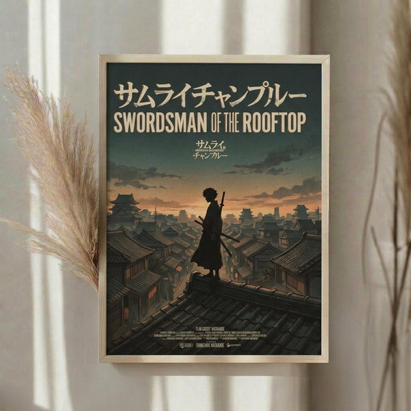 May include: Framed poster print displayed on white wall next to dried pampas grass stems. The artwork shows a silhouetted samurai figure standing on traditional Japanese rooftops at sunset, with Japanese text at top and "Swordsman of the Rooftop" in English below. The scene features warm orange and teal colors with detailed architectural elements spread across the cityscape. Light wood frame complements the neutral room setting.