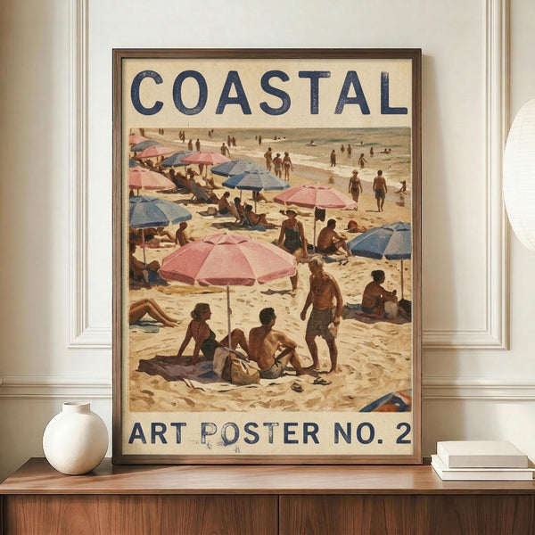 May include: Vintage-style coastal beach scene poster in brown frame, displayed on wooden sideboard with white ceramic vase and stacked books. The artwork shows beachgoers with pink and blue umbrellas on sandy shore, painted in warm earth tones with retro typography reading "COASTAL" and "ART POSTER NO. 2" against cream background.