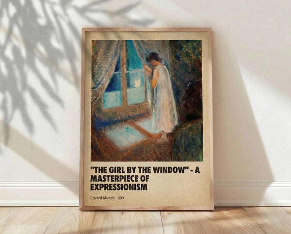May include: A framed poster print leaning against a white wall on light wooden flooring. The artwork shows a figure in a white nightgown standing by a blue-tinted window with flowing curtains in an expressionist painting style. The print features warm earth tones and blues with visible brushstroke textures. Natural shadows from foliage cast across the wall and frame, creating a serene room setting.