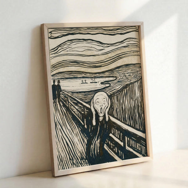 May include: Black and white reproduction of Edvard Munch's The Scream artwork displayed in a thin wooden frame, leaning against a white wall. The expressionist print shows a skeletal figure with hands to face in anguish on a bridge, with two silhouetted figures in background and swirling sky above. Bold linear woodcut-style illustration with dramatic perspective and flowing organic lines throughout the composition.