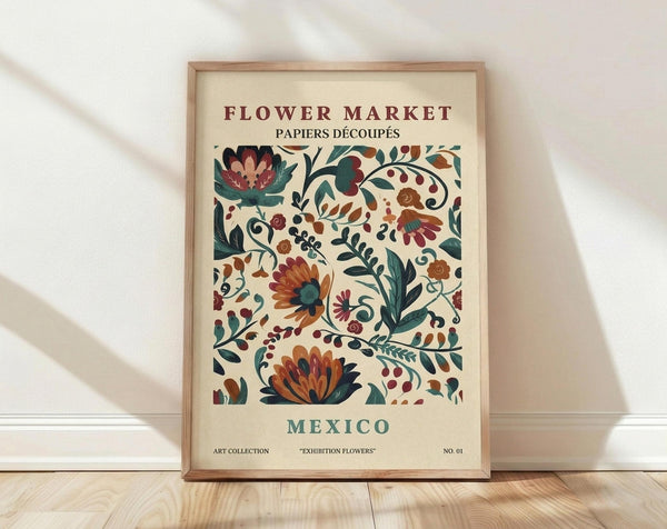 May include: Framed vintage-style botanical poster with colorful folk art flowers in burgundy, orange, and teal against cream background, displayed on light wood floor against white wall with natural shadows