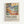May include: Framed poster print displaying a colorful fauvism-style tropical landscape with palm trees, rolling hills, and vibrant yellows, greens, blues, and coral tones. Below the artwork is bold black text reading "Matisse: A Master of Color and Form" with smaller descriptive text about an exhibition. The print is mounted in a light wood frame against a white wall.