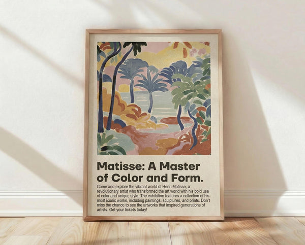 May include: Framed art print featuring a colorful tropical landscape with palm trees, rolling hills, and vibrant pink, yellow, green, and blue brushstrokes in an abstract style. The poster includes exhibition text about Matisse below the artwork. Natural wood frame sits on light wooden floor against white textured wall with soft shadows.
