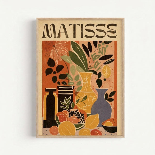 Framed poster featuring a Matisse-inspired still life composition with warm orange background. The artwork shows various vessels including a yellow vase with leafy plants, dark bottles, striped containers, and a purple vase, alongside fruits like oranges and pomegranate. Bold geometric shapes in earthy tones of orange, green, black, and yellow create a modern artistic style. The word "MATISSE" appears at the top in brown letters against a cream border. Light wood frame against white wall.
