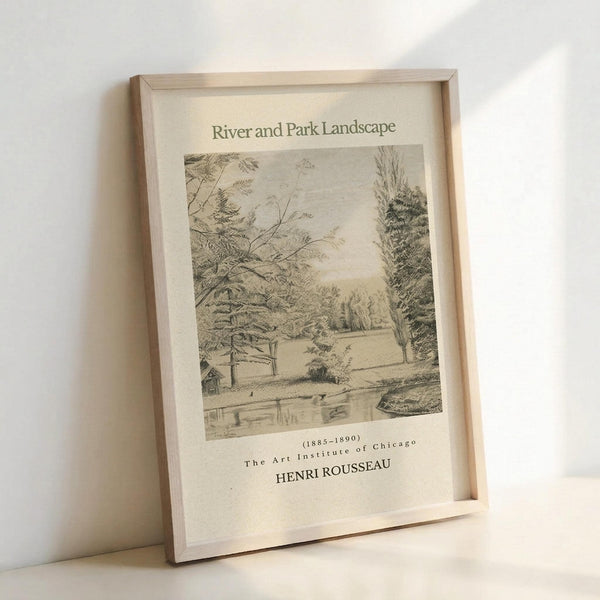 May include: Framed vintage-style art print featuring a sepia-toned landscape drawing with trees, a river, and parkland scenery. The print shows museum exhibition text including dates 1885-1890 and The Art Institute of Chicago attribution to Henri Rousseau. Light wood frame sits against white wall on white surface with soft natural lighting.