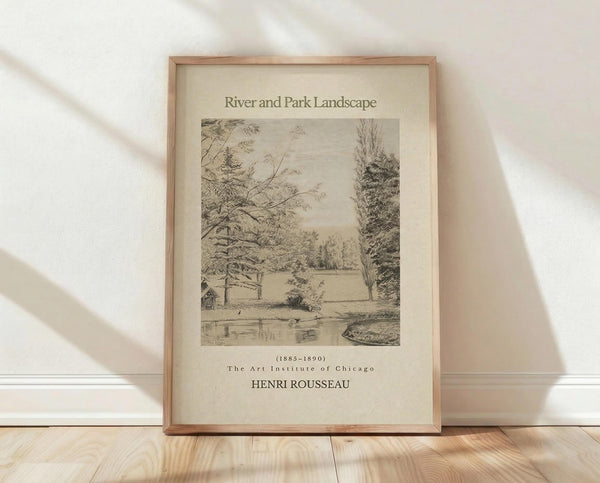 May include: Framed vintage botanical illustration print in light wood frame, leaning against white textured wall on wooden floor. The sepia-toned artwork depicts a peaceful riverside scene with trees, water, and a small structure. Soft natural lighting creates diagonal shadows across the minimalist setting. The print shows detailed pencil or etching style work typical of late 19th century landscape art.