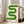 May include: Framed poster with green wavy geometric design resembling a flowing ribbon or snake-like form against cream background, displaying "bauhaus 1919" text below. Light wood frame leaning against white wall in bright living room with beige sofa, hardwood floors, and large windows with natural sunlight streaming in.