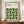 May include: Framed poster with cream background featuring green geometric leaf-like shapes arranged in a 4x4 grid pattern, with "BAUHAUS" text at top and "Modernism, minimalism & abstract arts 1919-1933" below, plus "School of Architecture Weimar, Dessau, Berlin" in upper right. Natural wood frame sits on wooden sideboard next to white ceramic vase and stacked books against white paneled wall.