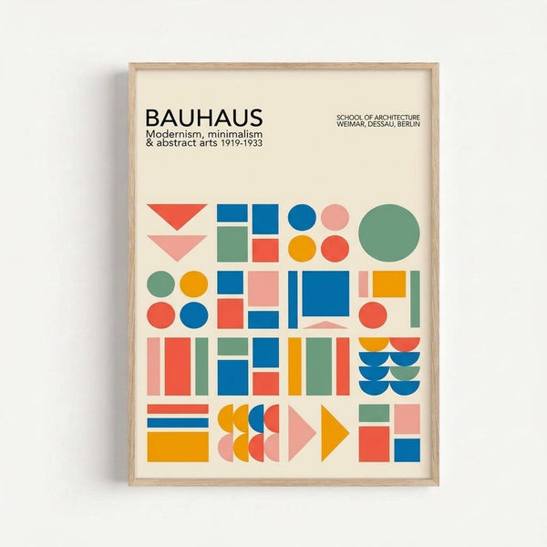 A framed minimalist poster featuring geometric shapes in bold colors including blue, orange, red, pink, and green arranged in a grid pattern. The design includes circles, squares, triangles, and rectangles in the Bauhaus modernist style. Text at the top reads "BAUHAUS" with "Modernism, minimalism & abstract arts 1919-1933" and "SCHOOL OF ARCHITECTURE WEIMAR, DESSAU, BERLIN". The print has a cream background and natural wood frame, displayed against a white wall.