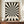 May include: Black and white optical illusion poster with radiating zigzag pattern creating tunnel-like depth effect, displayed in thin brown frame on wooden sideboard. Text reads "BAUHAUS 1919-1933 SCHOOL OF ARTS & CRAFTS" below the geometric design. Small white ceramic vase and stacked books sit nearby on warm wood surface against cream walls with white trim molding.