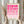 May include: Hands holding a framed geometric art print with pink gradient circles and semicircles in a grid pattern, text reading "BAUHAUS 1919-1933 SCHOOL OF ARTS & CRAFTS" at bottom. Light wood frame against cream background with dried pampas grass visible on left side. Person wearing beige ruffled sleeve top.