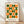 May include: Framed geometric art print featuring alternating green and orange circles and semicircles in a grid pattern on cream background, displayed in light wood frame leaning against white wall on blonde hardwood floor with soft natural lighting and shadows