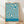 May include: Framed vintage-style poster with flowing teal and cream wavy lines in abstract pattern, displayed against white wall on light wooden floor. Natural light creates soft shadows across the scene. Thin wooden frame surrounds the geometric design with "BAUHAUS" text and German exhibition details at bottom.